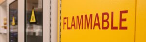 Door of a Yellow Flammable Chemicals Cabinet. Our consultants can identify and evaluate fire hazards and recommend fire protection measures to reduce fire risk through fuel load analyses, fire and explosion consequence modelling, and suppression and mitigation analyses.